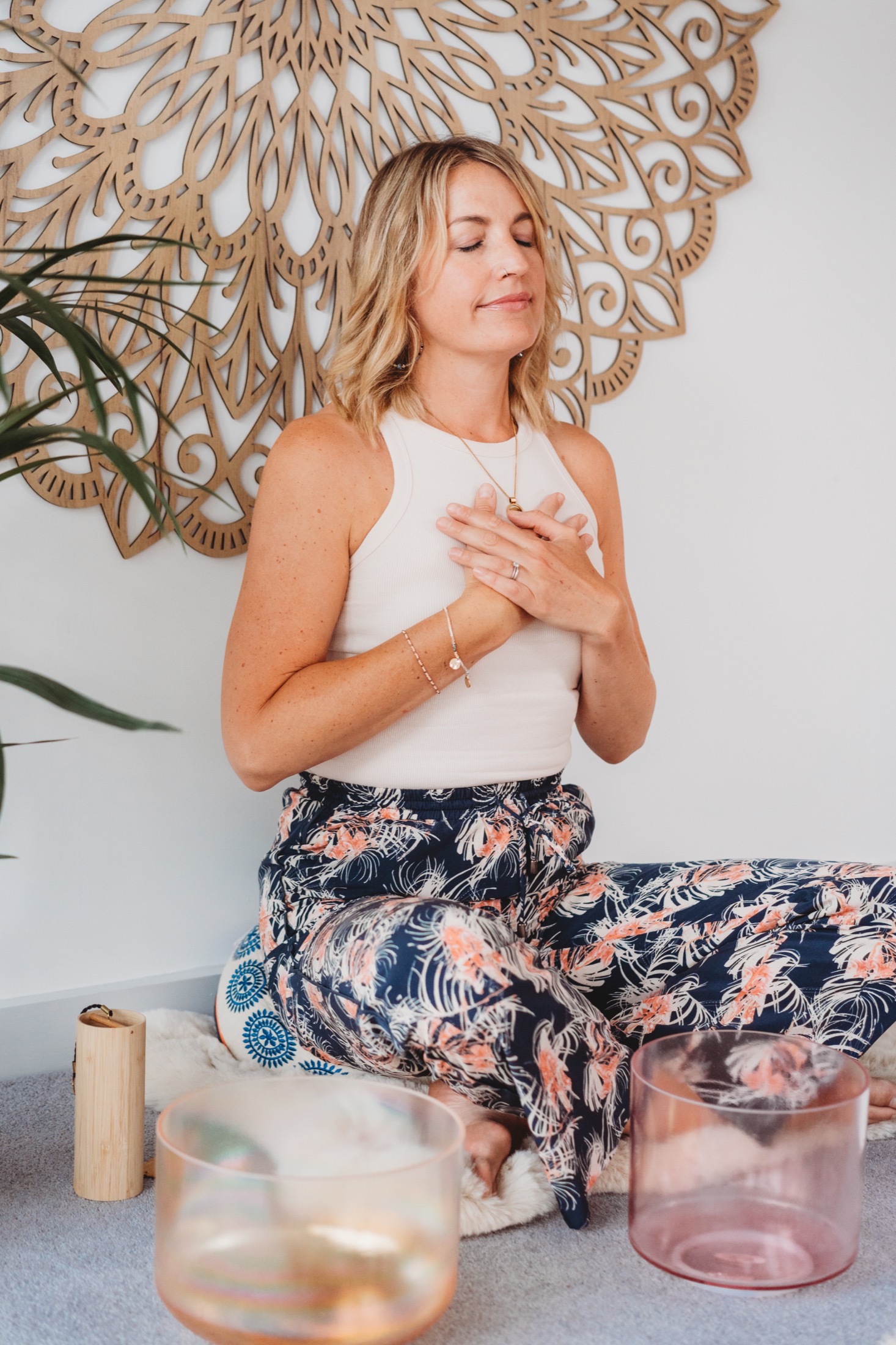 Rachael seated in meditation at the Cotswold Soul studio with crystal singing bowls